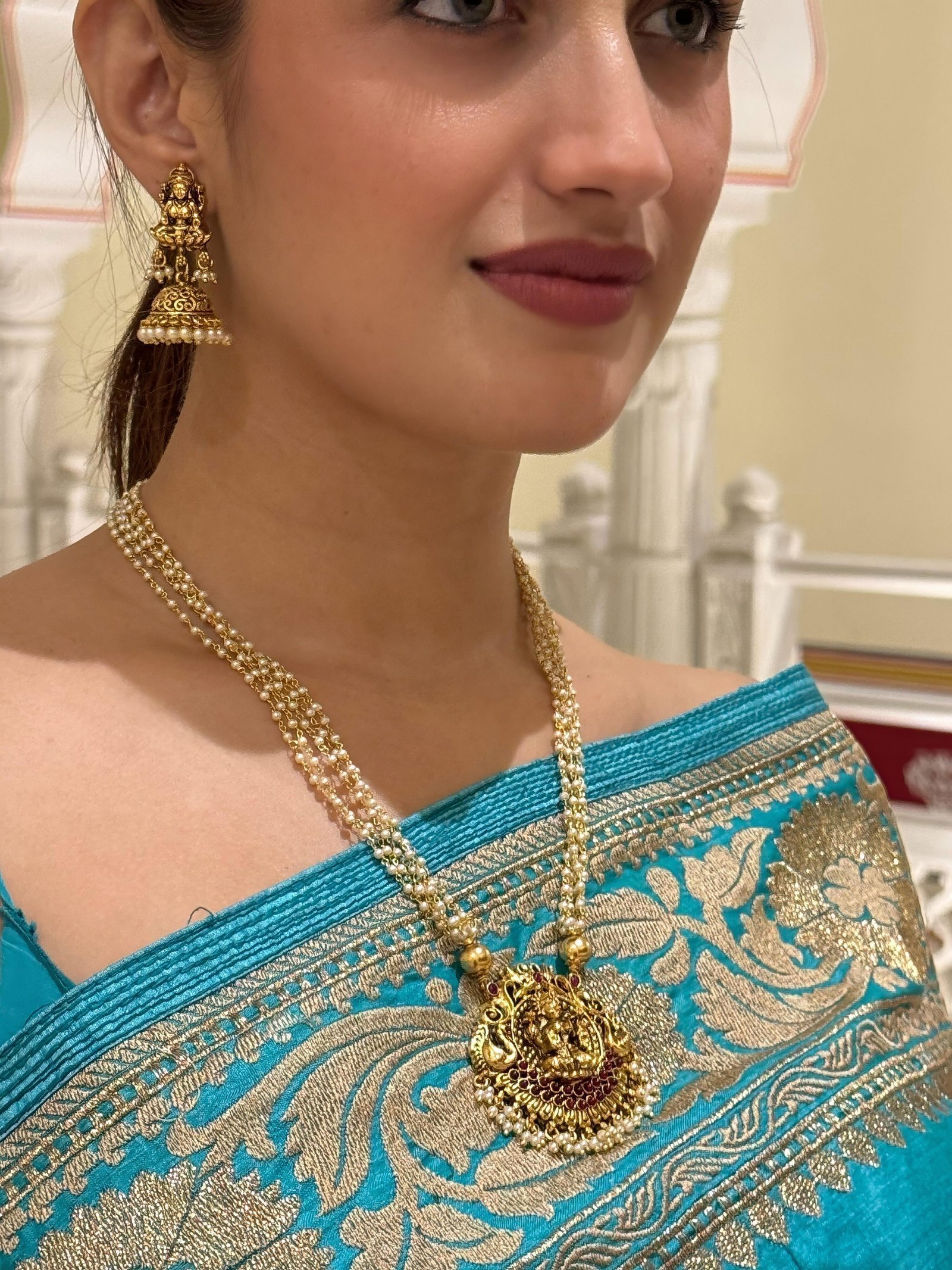 Radiance of Tradition: Pearl & Gold Temple Jewelry Set